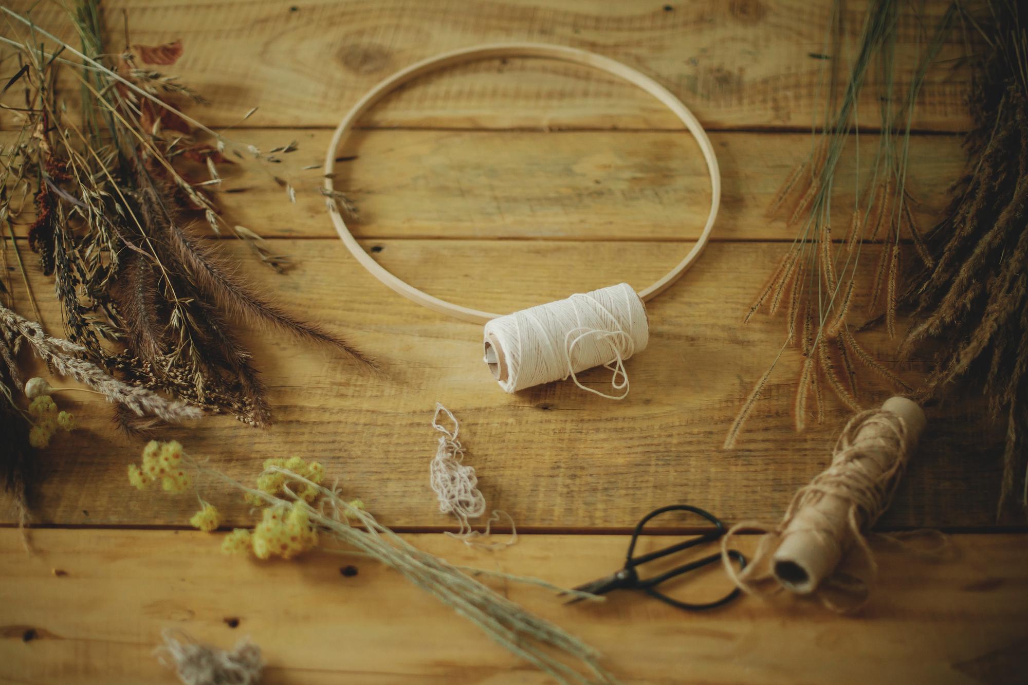 artisan workspace with hoop and threads